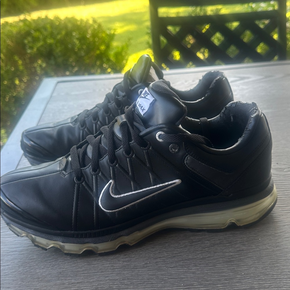 Nike Black and Silver leather Running Shoes good condition